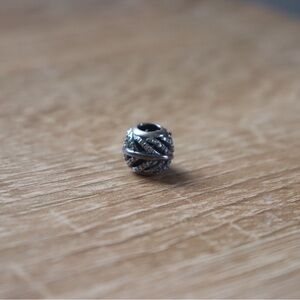Pandora Sterling Silver "Light as a Feather" Charm, model 791186CZ.